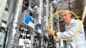 a man touching a machine in a lab