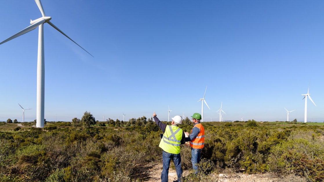 Engineers working on wind turbine control projects and production.
