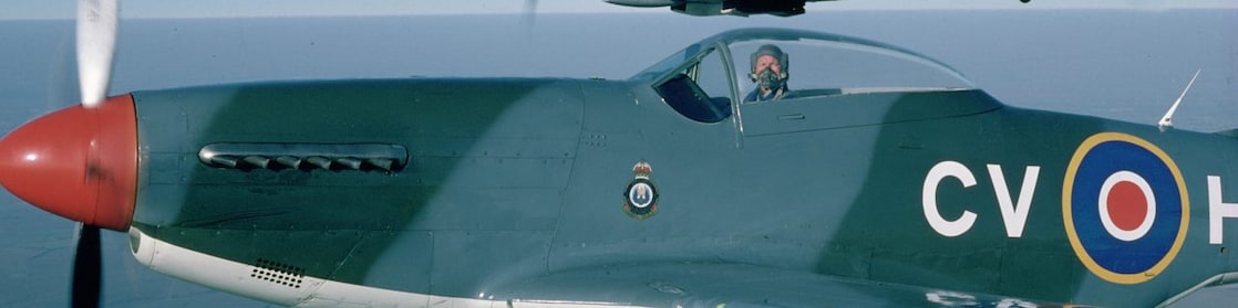 Pilot sitting in spitfire aircraft