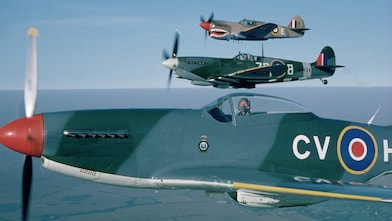 Pilot sitting in spitfire aircraft