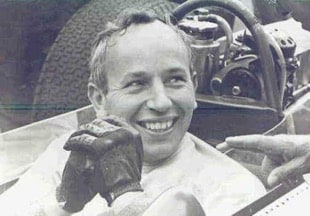 John Surtees sitting in racing car