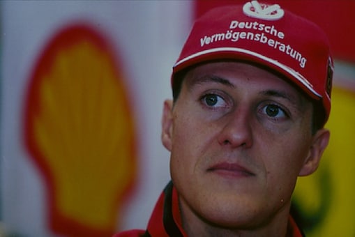 Michael Schumacher in front of Shell Pecten