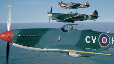 Pilot sitting in spitfire aircraft