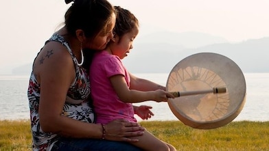 Engaging with Nivkh community members at the traditional Fishermen Day festival on Sakhalin Island